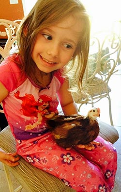 Brianna holding a baby chicken