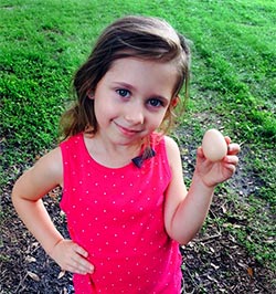 Brianna holding her first egg